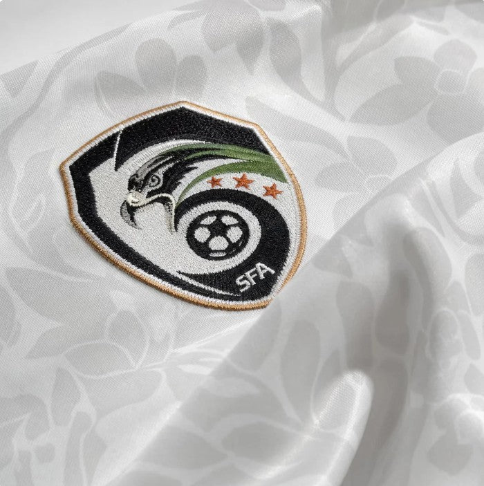 Close-up of the breathable fabric texture of the Syria football jersey