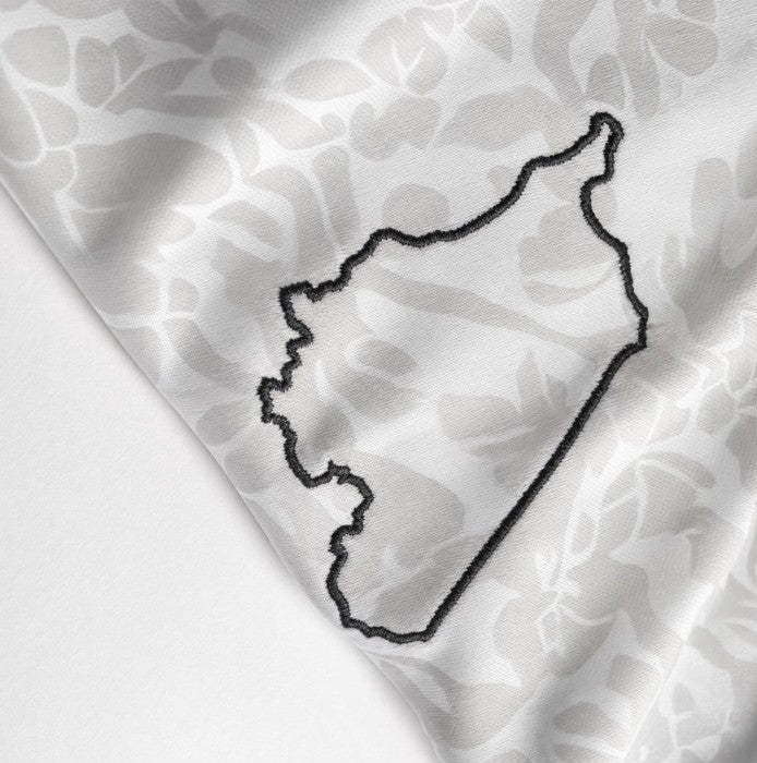 Close-up of the collar and stitching detail on the Syrian football jersey